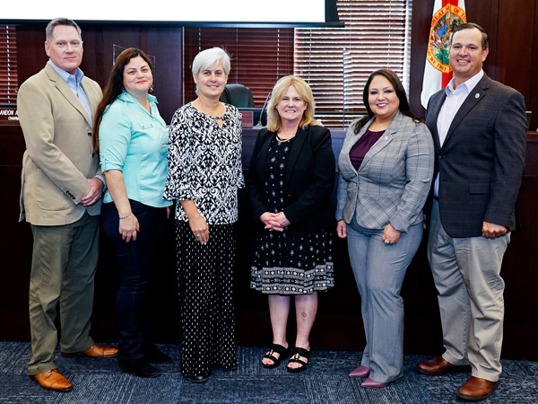 Left to right: Commission Chairman Brandon Arrington, Dist. 1 Commissioner Peggy Choudhry, Dist. 4 Commissioner Cheryl Grieb, Chief Judge of the Ninth Judicial Circuit Lisa T. Munyon, Vice Chairwoman Viviana Janer, and Dist. 5 Commissioner Ricky Booth.