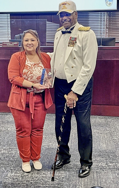 Chairwoman Viviana Janer and Dr. Johnson with award