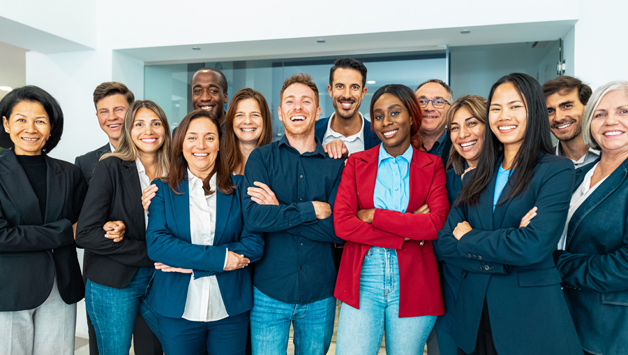 Smiling group of employees standing together