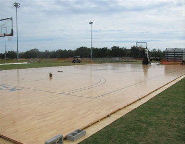 On February 3, 2018, Austin Tindall Sports Complex erected the first wooden basketball court, outside on grass, to host the first ever outdoor sanctioned high school basketball game.