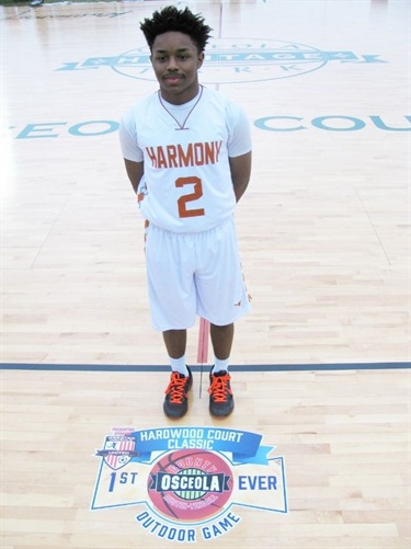 Stephen Frederick, of Harmony High School, scored the first points of the game on a free throw.