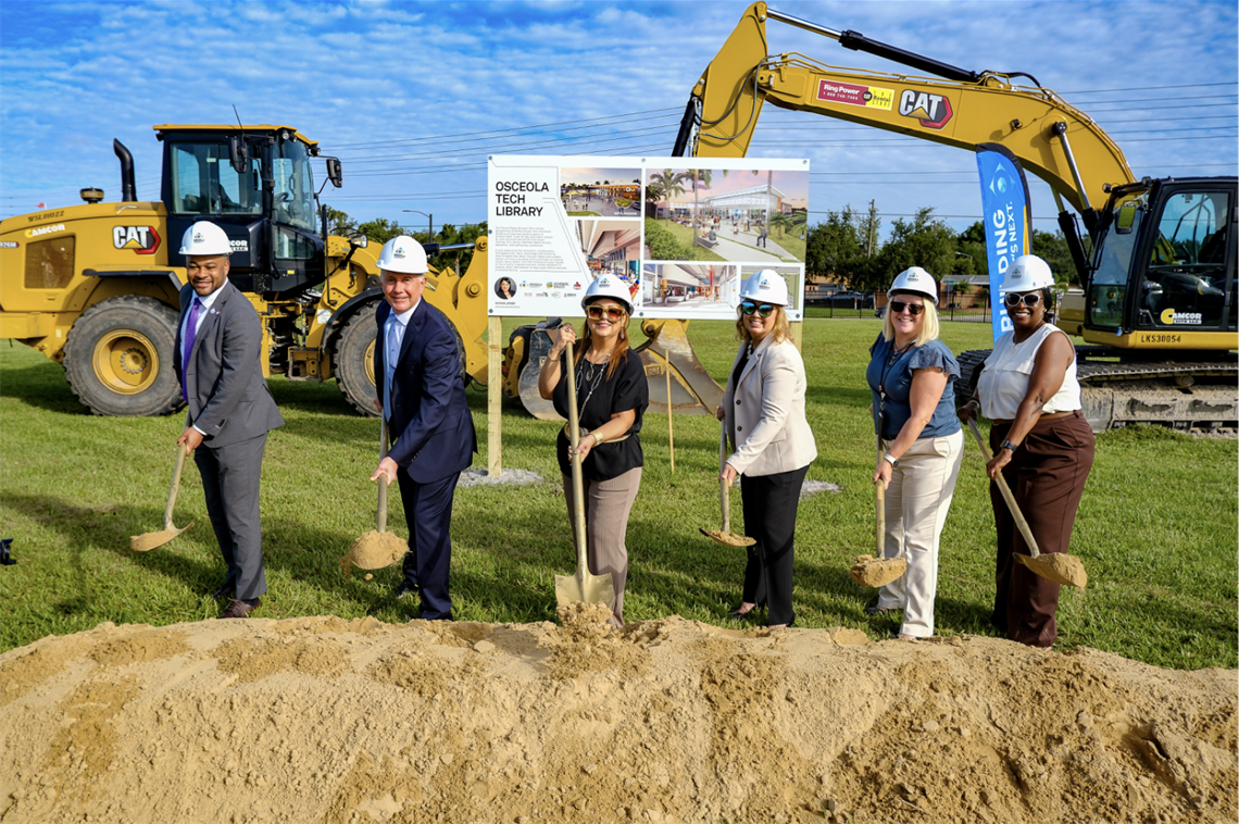 Chairwoman Viviana Janer (C) is joined by Orlando City Soccer COO & General Counsel Caesar Lopez (L); Osceola County Manager Don Fisher (2nd from L); Osceola COO Beth Knight (3rd from R); Osceola Deputy County Manager Donna Renberg (2nd from R); and Osceola Assistant County Manager Celestia McCloud (R) at the groundbreaking for the Osceola County Tech Library.