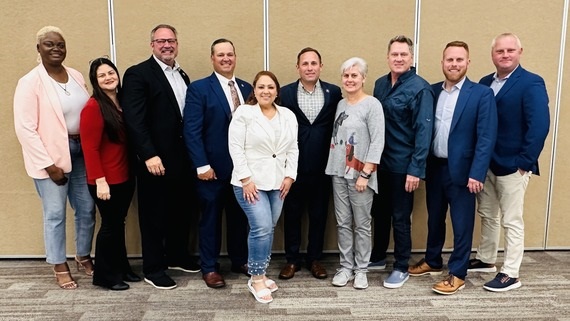 (L-R) St. Cloud Council Member Jennifer Paul; Osceola County Commissioner Peggy Choudhry (D-1); St. Cloud Council Member Ken Gilbert; Osceola County Commissioner Ricky Booth (D-5); Osceola County Chairwoman Viviana Janer (D-2); St. Cloud Mayor Chris Robertson; Osceola County Commissioner Cheryl Grieb (D-4); Osceola County Vice Chairman Brandon Arrington (D-3); St. Cloud Council Member Kolby Urban; and St. Cloud Deputy Mayor Shawn Fletcher