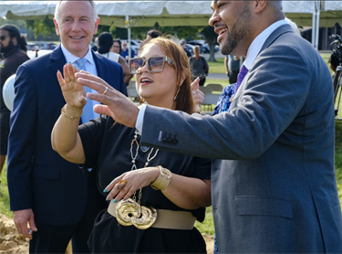 Osceola County Manager Don Fisher (L) looks on as Chairwoman Viviana Janer (C) explains facets of the Osceola Tech Library to Orlando City Soccer COO & General Counsel Caesar Lopez.