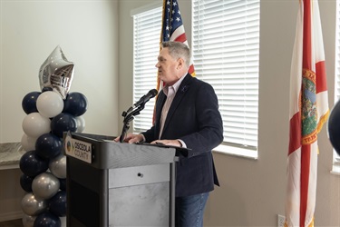 Osceola County Vice Chairman, Brandon Arlington, gives opening remarks to celebrate the development of Falcon Trace II in Kissimmee, Florida.