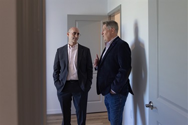 Vice Chairman Brandon Arrington and Birdsong Housing Partners CEO Steve Auger touring one of the new units at Falcon Trace II apartment complex.