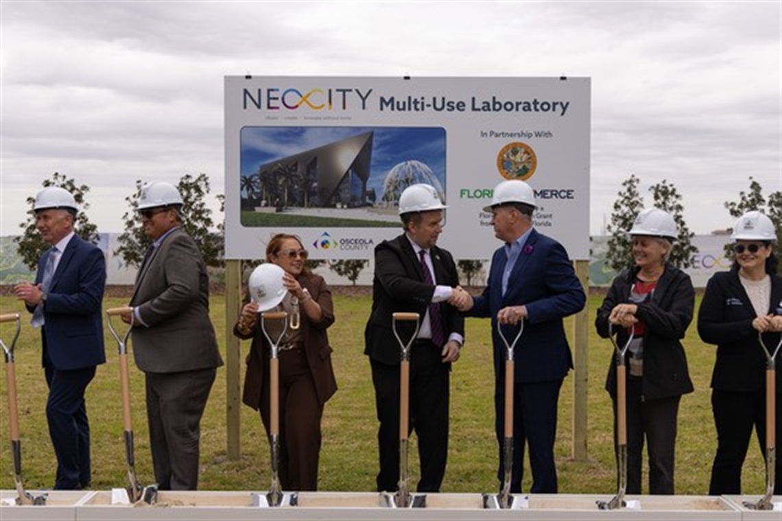 (L-R) Osceola County Manager Don Fisher, Osceola County D5 Commissioner Ricky Booth, Osceola County D2 Commissioner Viviana Janer, Secretary of Florida Commerce J. Alex Kelly, Osceola County Chairman and D3 Commissioner Brandon Arrington, Osceola County Vice Chairwoman and D4 Commissioner Cheryl Grieb, Osceola County D1 Commissioner Peggy Choudhry
