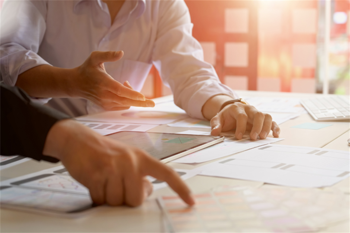 Businesspeople strategizing plans on table