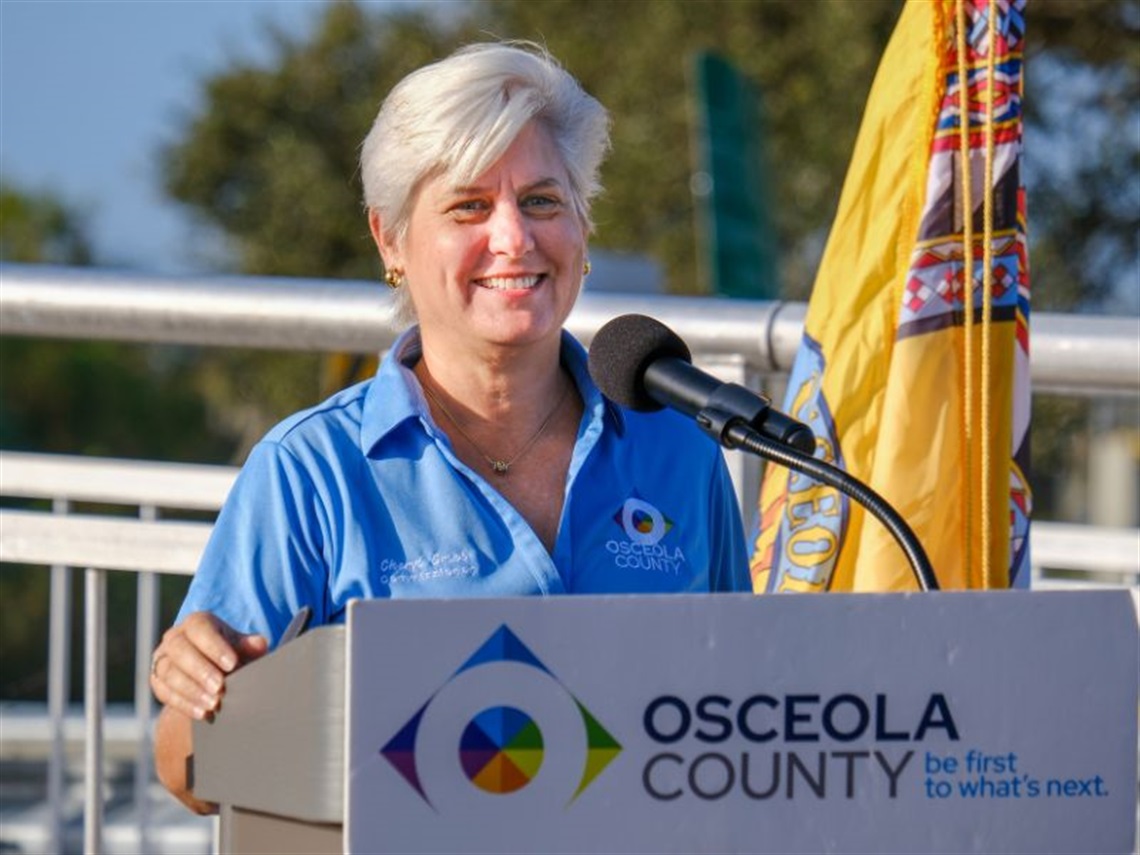 Osceola County Commission Chair Cheryl Grieb speaks at the opening of the new Fortune Lakeshore trail.